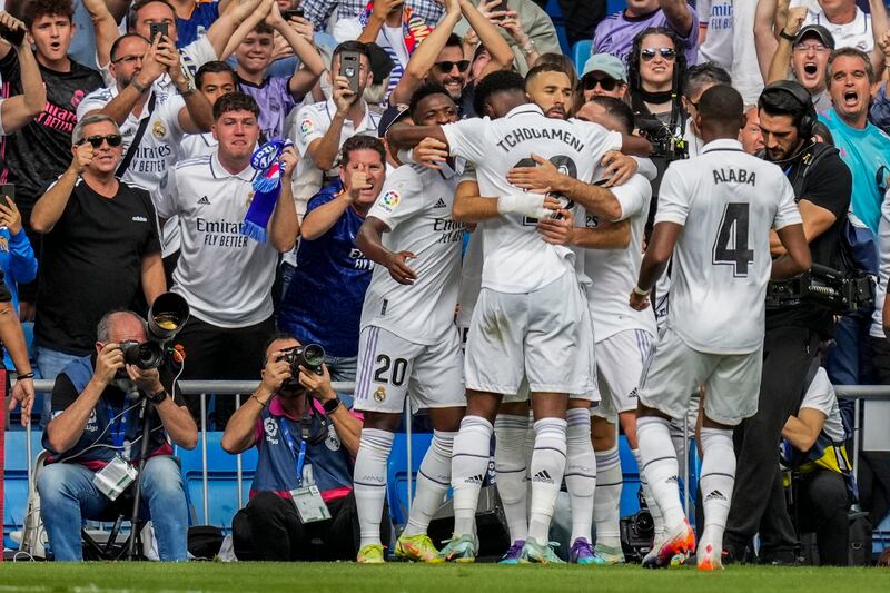 Real Madrid's Karim Benzema is congratulated by teammates. AP