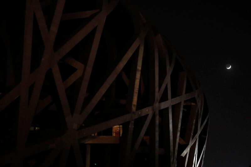 China: A view of the National Stadium (Bird's Nest) with lights off during Earth Hour in Beijing. EPA