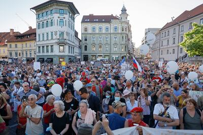 Protesters hold an anti-government rally in Ljubljana, Slovenia, where Mr Jansa's government is accused of undermining media freedom. AP 