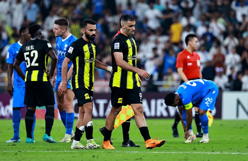 Al Ittihad's Abderrazak Hamdallah makes his way off the pitch after being shown a red card. Reuters