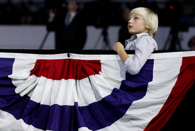 A child attends a rally held by US President Joe Biden with Democratic nominee for Maryland Governor Wes Moore,   Senator Chris Van Hollen and other Maryland Democrats, at Bowie State University. Reuters