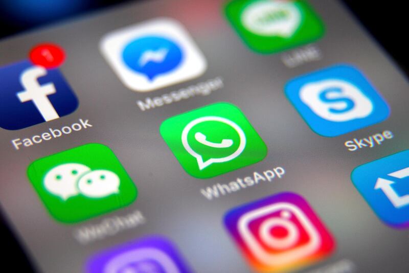 epa07568741 (FILE) - The logo of the messaging application WhatsApp (C) is pictured on a smartphone screen in Taipei, Taiwan, 26 September 2017 (reissued 14 May 2019). Facebook's messenger service WhatsApp has been the target of hackers, with remotely installed surveillance software developed Israeli security firm NSO Group, according to media reports.  EPA/RITCHIE B. TONGO