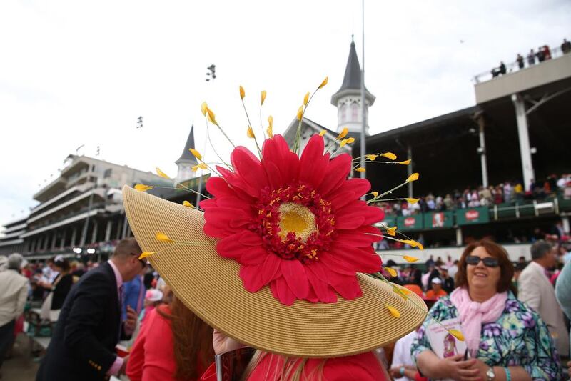 A race fan wearing a festive hat attends the 140th running of the Kentucky Oaks at Churchill Downs on May 2, 2014 in Louisville, Kentucky. Andy Lyons / Getty Images / AFP