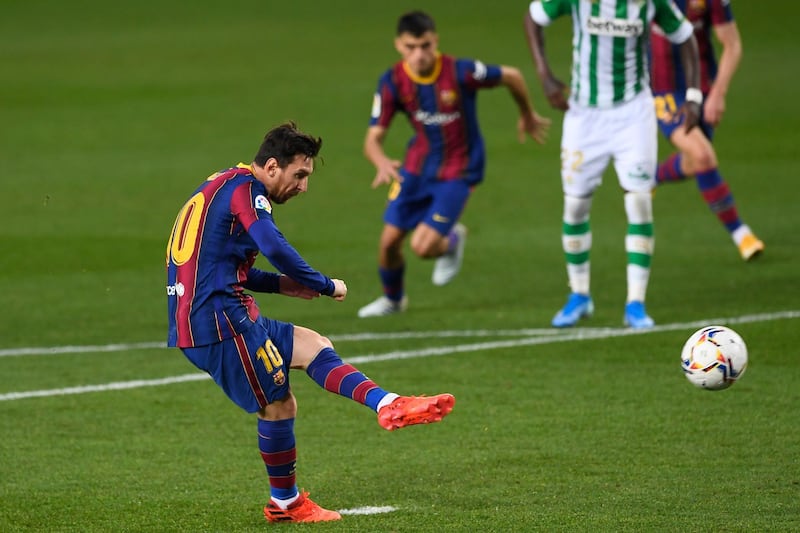 Lionel Messi scores from the penalty spot against Real Betis at Camp Nou. AFP