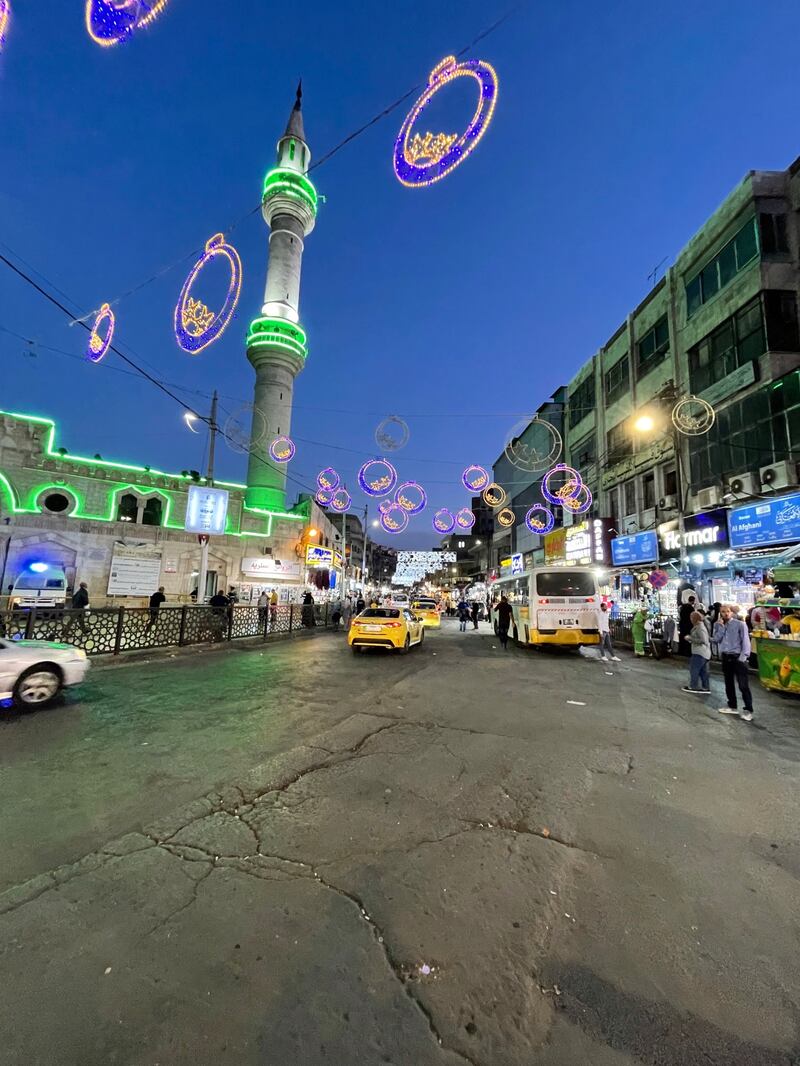 Cars pass Husseini Mosque on King Talal Street in downtown Amman. 