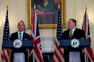Secretary of State Mike Pompeo listens at a news conference with British Foreign Secretary Dominic Raab at the State Department in Washington, Wednesday, Sept. 16, 2020. (Nicholas Kamm/Pool via AP)