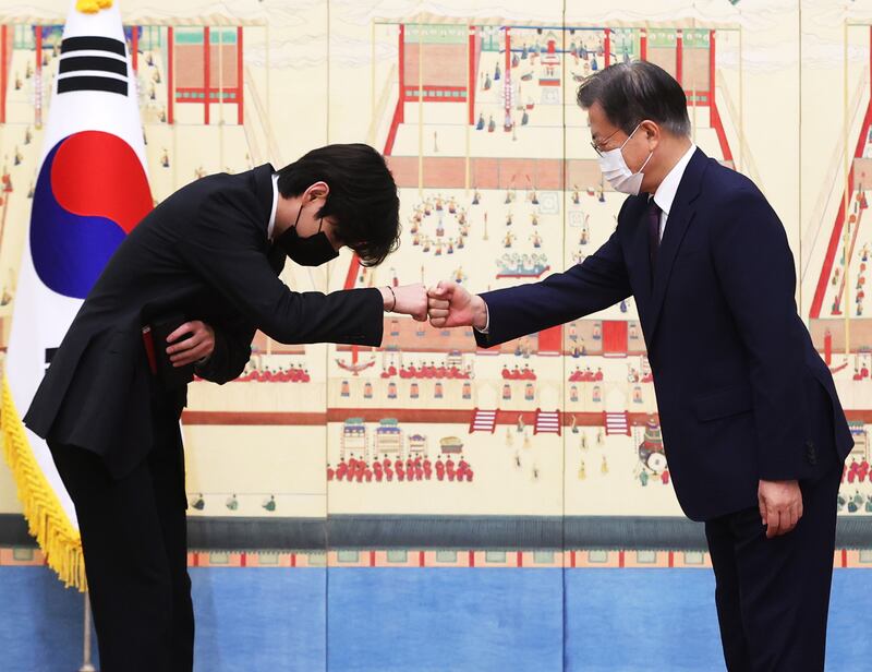 South Korean President Moon Jae-in greeting BTS member V at The Blue House in Seoul. EPA