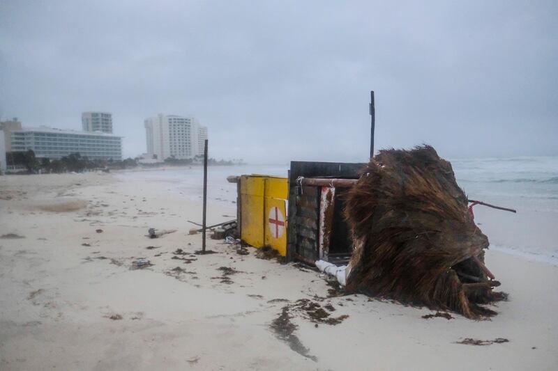 A lifeguard tower lies on its side after it was toppled over by Hurricane Delta in Cancun, Mexico. AP Photo