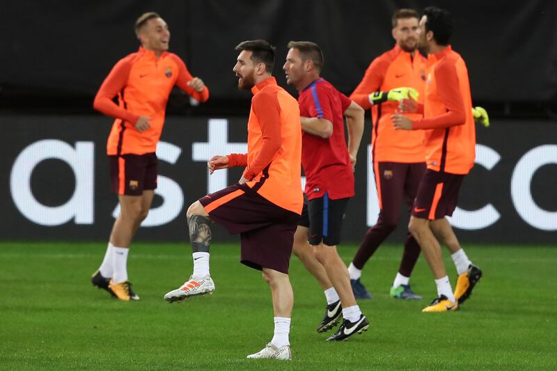 Lionel Messi warms up during a training session. Petros Giannakouris / AP Photo