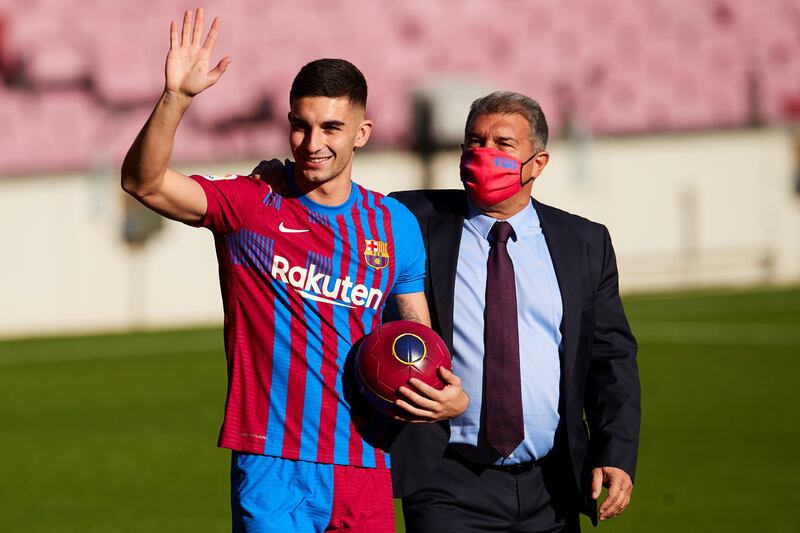 Ferran Torres and Barcelona's president Joan Laporta during his unveiling at Camp Nou. EPA