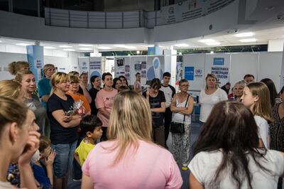 Ukrainian refugees in an adapted events building that is now one of their main shelters in Chisinau, Moldova, Getty