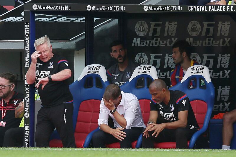 Crystal Palace's manager Frank de Boer, centre, looks dejected during the English Premier League soccer match between Crystal Palace and Swansea City at Selhurst Park in London, Saturday Aug. 26, 2017. (AP Photo/Tim Ireland)