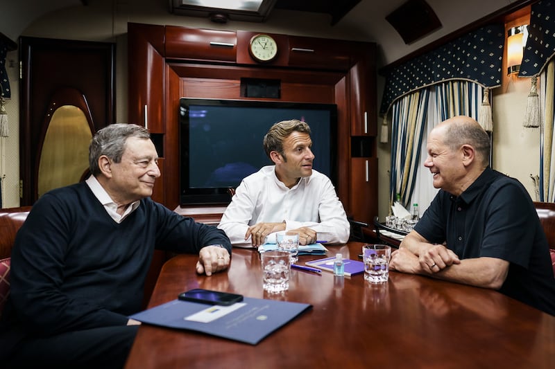 Italy's Prime Minister Mario Draghi, French President Emmanuel Macron and Mr Scholz on a night train travelling to Kyiv, Ukraine, in June. Getty Images