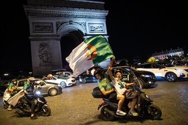 Algeria supporters celebrate on the Champs-Elysees after their Africa Cup of Nations title win last Friday. Ian Langsdon / EPA