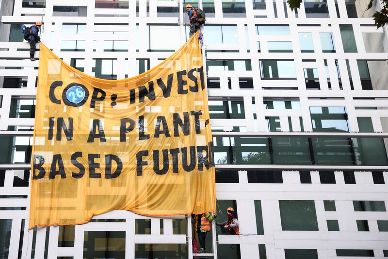 They displayed a yellow banner saying: 'Cop26: Invest in a plant-based future.'  Reuters