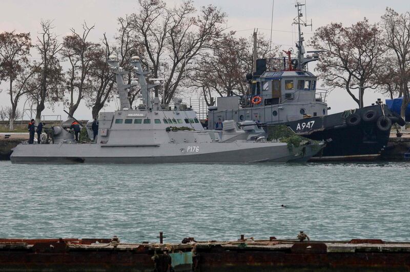 (FILES) In this file photo taken on November 26, 2018 Seized Ukrainian military vessels are seen in a port of Kerch, Crimea. President Donald Trump has "deep concern" over Russia's armed seizure of three Ukrainian ships, the White House said November 28, 2018 as Trump decides whether to cancel planned talks with President Vladimir Putin. During a phone call between Trump and his Turkish counterpart Recep Tayyip Erdogan, "the two leaders expressed deep concern about the incident in the Kerch Strait and the continued detainment of Ukraine's vessels and crew members," White House spokeswoman Sarah Sanders said.

 / AFP / STR
