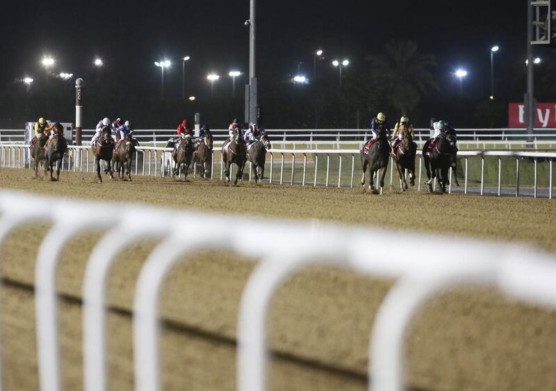 A view of horses racing at Meydan Racecourse, site of the Dubai World Cup. Chris Ratcliffe / Bloomberg