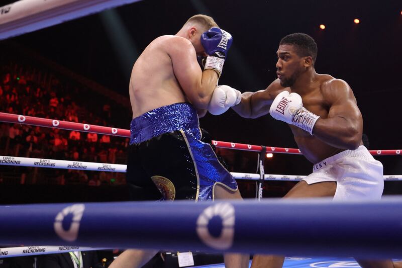 Anthony Joshua hits Otto Wallin during their heavyweight boxing match. AFP