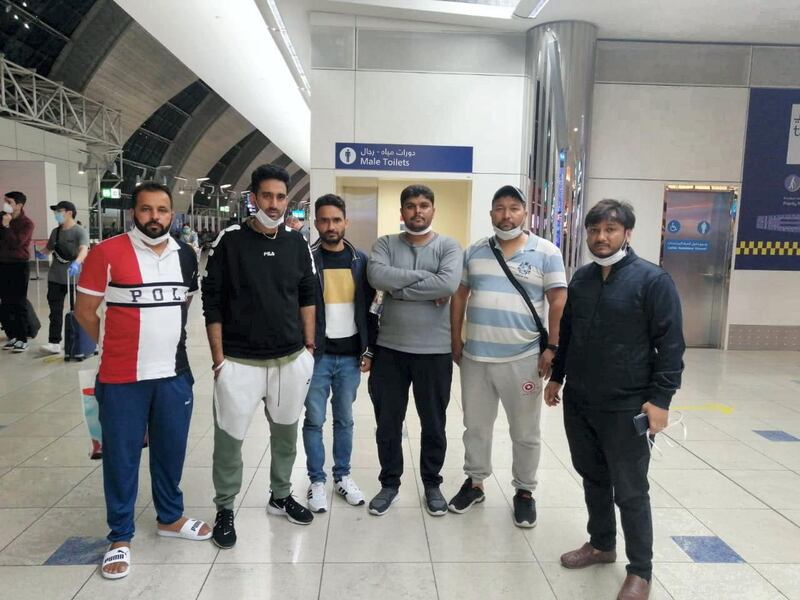 A group of passengers including Harjinder Singh, left, and Deepak Gupta, right, have been stranded at Dubai airport since March 18 due to coronavirus restrictions. Courtesy: Deepak Gupta