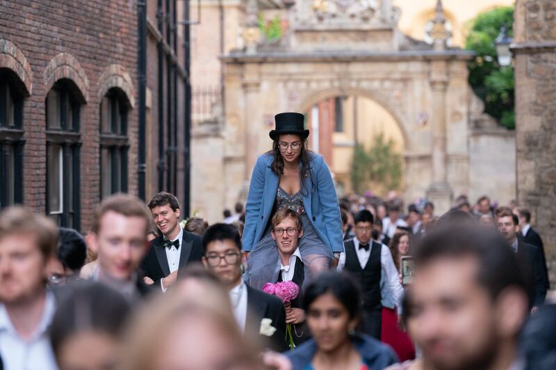 Students from Cambridge University make their way home after celebrating the end of the academic year at a May Ball in Trinity College in 2022. PA Wire