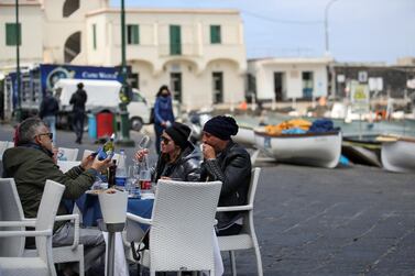 People sit at a restaurant on the Italian tourist island of Capri. Reuters 