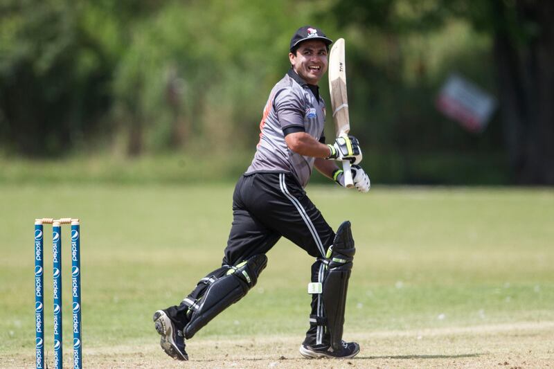 KING CITY, CANADA : August 6, 2013 UAE batman Shaiman Anwar reacts as he watches the ball head towards the boundary as he reaches his century on the final ball of the innings against   Canada during the one day international  at the Maple Leaf Cricket club in King City, Ontario, Canada ( Chris Young/ The National). For Sports *** Local Caption ***  chy201.jpg