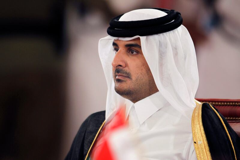 epa03758163 (FILE) A file photo dated 24 December 2012 shows Qatari Crown Prince Sheikh Tamim bin Hamad bin Khalifa Al-Thani attending the opening session of the 33rd Gulf leaders summit in Sakhir Palace, South of Manama, Bahrain. The Doha-based Al Jazeera broadcaster reported on 24 June 2013 that Qatari Emir Sheikh Hamad bin Khalifa Al Thani has told members of the royal family that he plans to hand over power to his son, Sheikh Tamim. The royal court said the emir will address the nation on 25 June without elaborating.  EPA/STR *** Local Caption ***  03758163.jpg