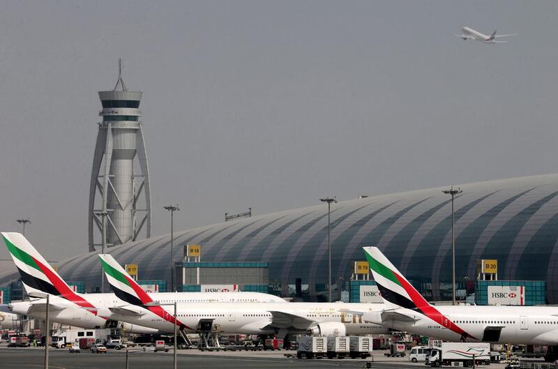 The seasonal rush of travellers, in particular UAE residents returning for the start of the academic year, boosted traffic at Dubai International. Ashraf Mohammad / Reuters