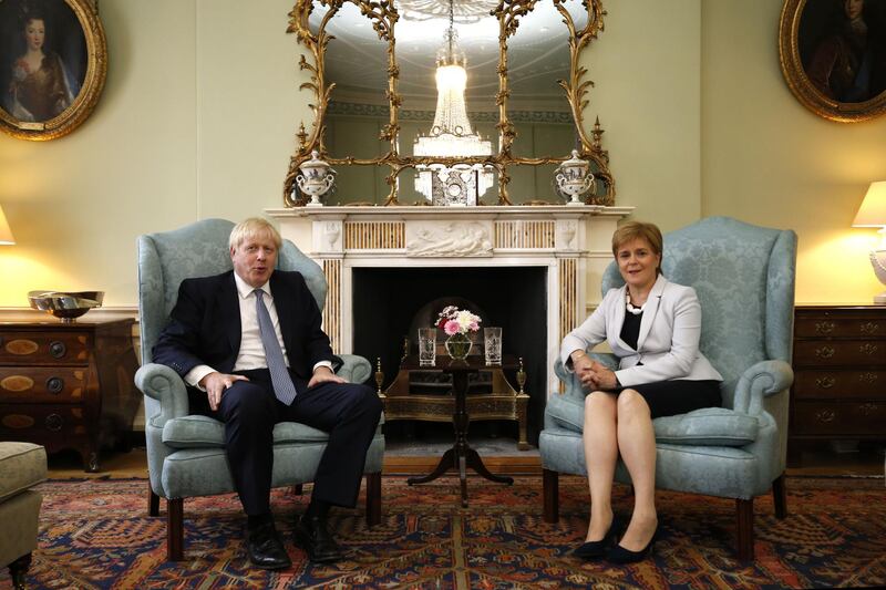Britain's Prime Minister Boris Johnson (L) and Scotland's First Minister Nicola Sturgeon (R) pose for a photograph before talks at Bute House in Edinburgh during his visit to Scotland on July 29, 2019. New British Prime Minister Boris Johnson makes his first official visit to Scotland on Monday in an attempt to bolster the union in the face of warnings over a no-deal Brexit.  / AFP / POOL / POOL / Duncan McGlynn

