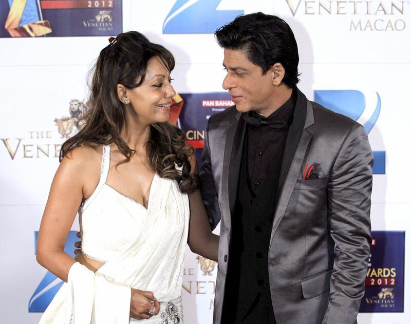 The Bollywood superstar Shah Rukh Khan, right, with his wife Gauri. Kin Cheung / AP Photo