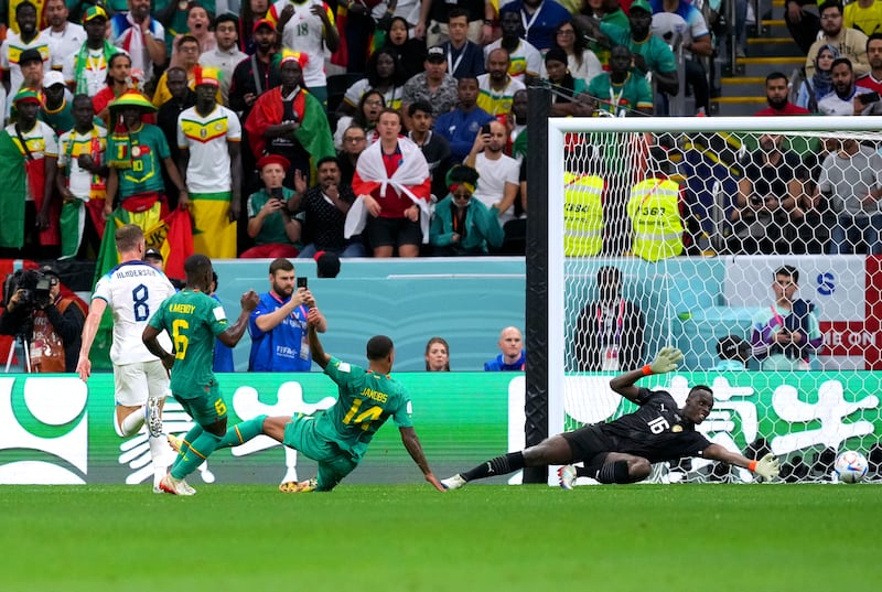 England's Jordan Henderson, left, scores their first goal. PA