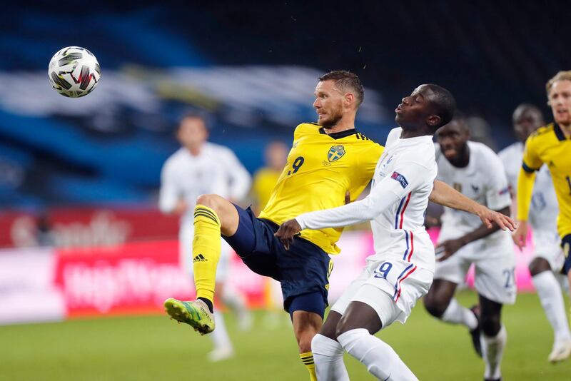 Sweden's Marcus Berg and France's Ferland Mendy. EPA