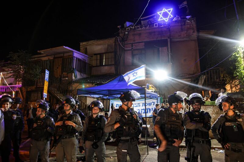 Israeli border guards stand in front of a house in the Sheikh Jarrah neighbourhood of East Jerusalem after Knesset member Itamar Ben-Gvir of the Jewish Power party has set up a make-shift office there on May 6, 2021. AFP