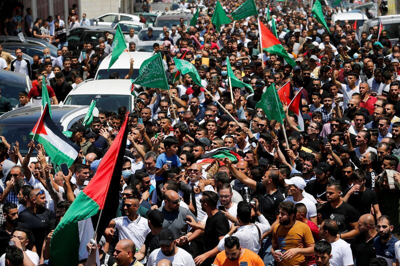 Mourners attending the funeral of Palestinian activist Nizar Banat chanted against the Palestinian Authority and President Mahmoud Abbas. Reuters