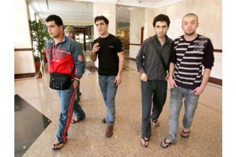 Mohammed al Khatib, Hani abu Sha'ar, Ghassan Shakshak and Ghassan Salem have been stranded at Dubai airport for more than a month.