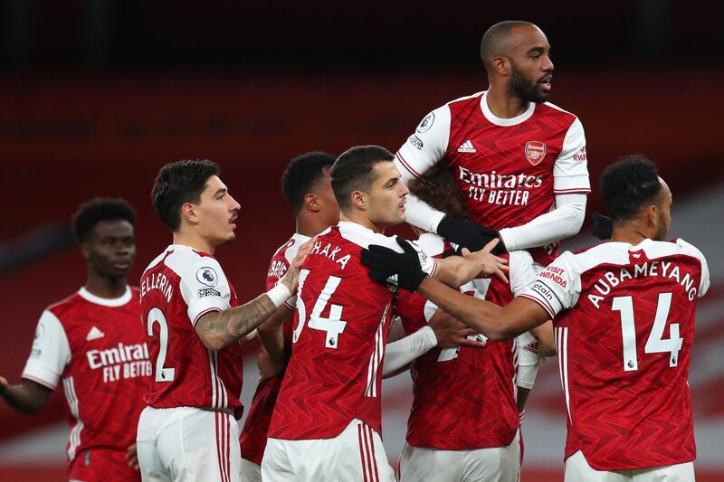 LONDON, ENGLAND - OCTOBER 25: Alexandre Lacazette of Arsenal celebrates a goal with his team mates that is later disallowed for offside during the Premier League match between Arsenal and Leicester City at Emirates Stadium on October 25, 2020 in London, England. Sporting stadiums around the UK remain under strict restrictions due to the Coronavirus Pandemic as Government social distancing laws prohibit fans inside venues resulting in games being played behind closed doors. (Photo by Catherine Ivill/Getty Images)