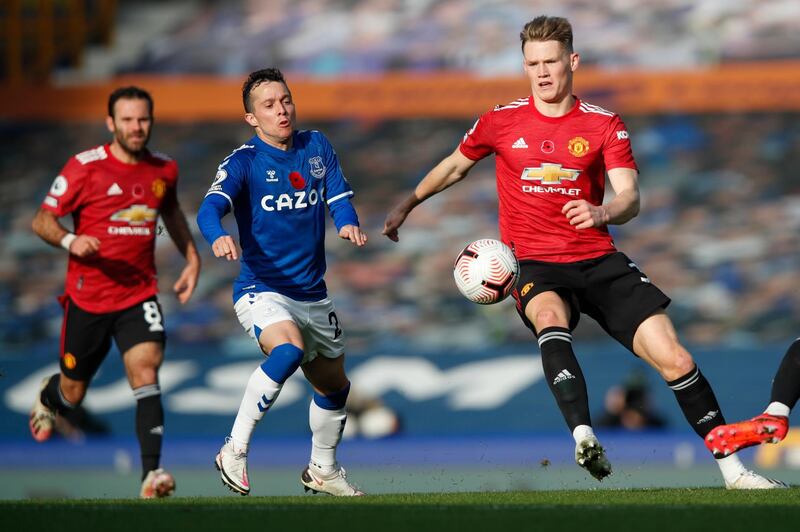 Everton's Bernard, left, is challenged by Manchester United's Eric Bailly at Goodison Park on Saturday. AP