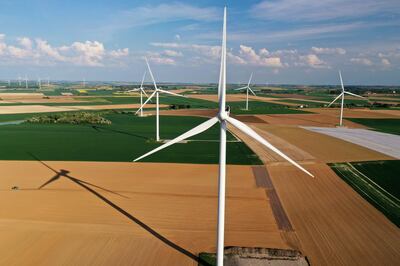 FILE PHOTO: An aerial view shows power-generating windmill turbines in a wind farm in Graincourt-les-Havrincourt, France, April 27, 2020. Picture taken with a drone REUTERS/Pascal Rossignol/File Photo