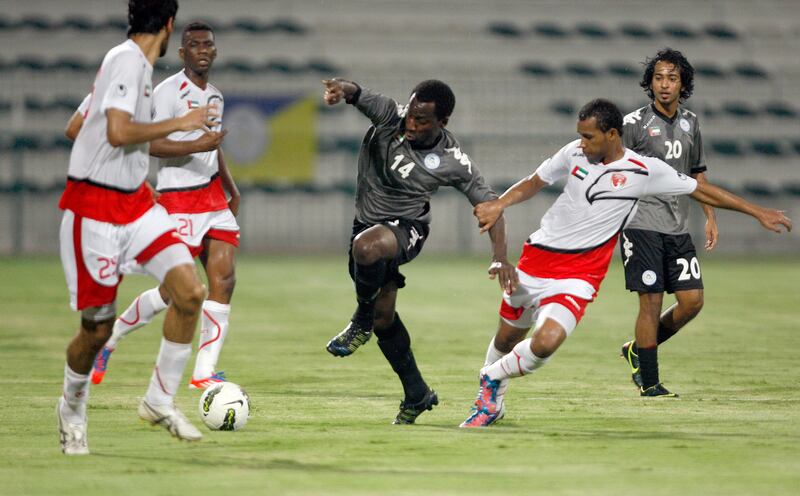  Dubai, United Arab Emirates, Sept. 9 2012,  Emirates vs Al Dhafra- (left) Al Dhafra's #14 works the ball free as Emirates defenders surrond Al Dhafra #14 . Mike Young / The National??