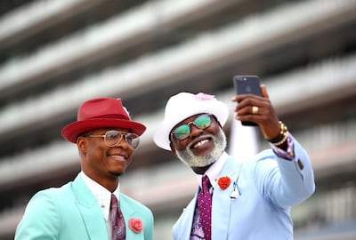 DUBAI, UNITED ARAB EMIRATES - MARCH 30: Two fans take a selfie photograph during the Dubai World Cup at Meydan Racecourse on March 30, 2019 in Dubai, United Arab Emirates. (Photo by Francois Nel/Getty Images)