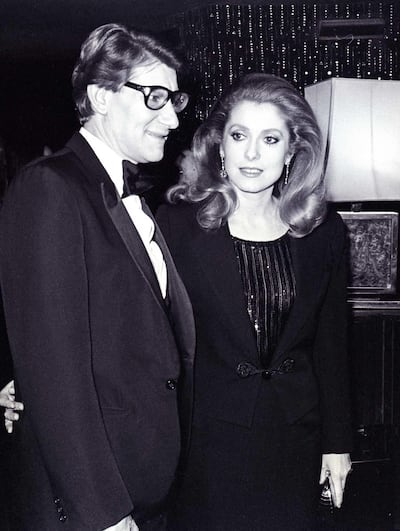 Yves Saint Laurent and Catherine Deneuve in 1982. Courtesy of Christie's