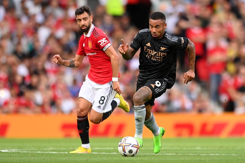 MANCHESTER, ENGLAND - SEPTEMBER 04: Gabriel Jesus of Arsenal is challenged by Bruno Fernandes of Manchester United  during the Premier League match between Manchester United and Arsenal FC at Old Trafford on September 04, 2022 in Manchester, England. (Photo by Michael Regan / Getty Images)