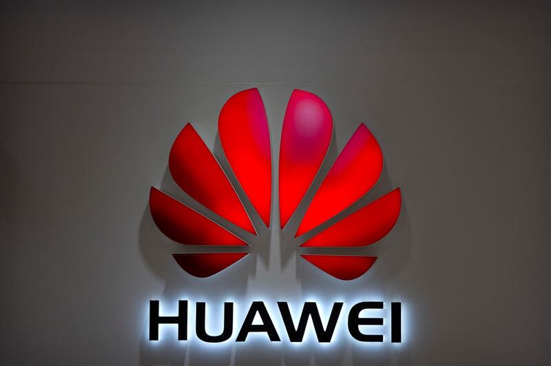 FILE - In this Wednesday, July 4, 2018, photo, the Huawei logo is seen at a Huawei store at a shopping mall in Beijing. Chinese-owned telecommunications giant Huawei has been blocked from rolling out Australia's 5G network due to security concerns. (AP Photo/Mark Schiefelbein, File)