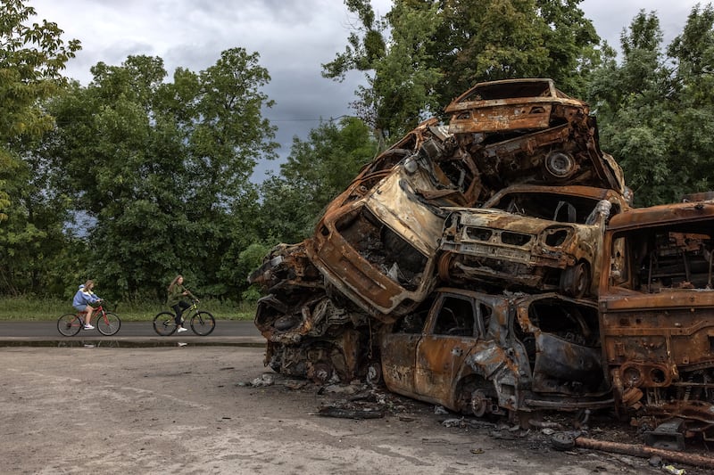 Burnt out cars destroyed in Russian attacks are piled up in Hostomel. EPA