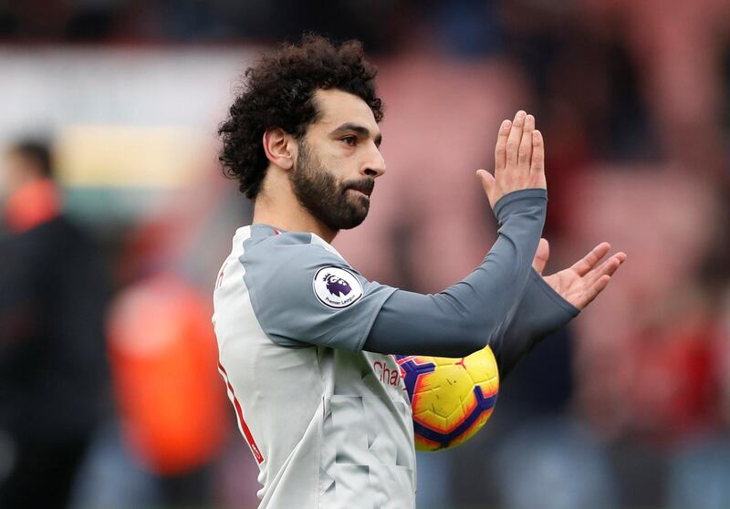 Soccer Football - Premier League - AFC Bournemouth v Liverpool - Vitality Stadium, Bournemouth, Britain - December 8, 2018  Liverpool's Mohamed Salah applauds fans after the match   Action Images via Reuters/Matthew Childs  EDITORIAL USE ONLY. No use with unauthorized audio, video, data, fixture lists, club/league logos or "live" services. Online in-match use limited to 75 images, no video emulation. No use in betting, games or single club/league/player publications.  Please contact your account representative for further details.