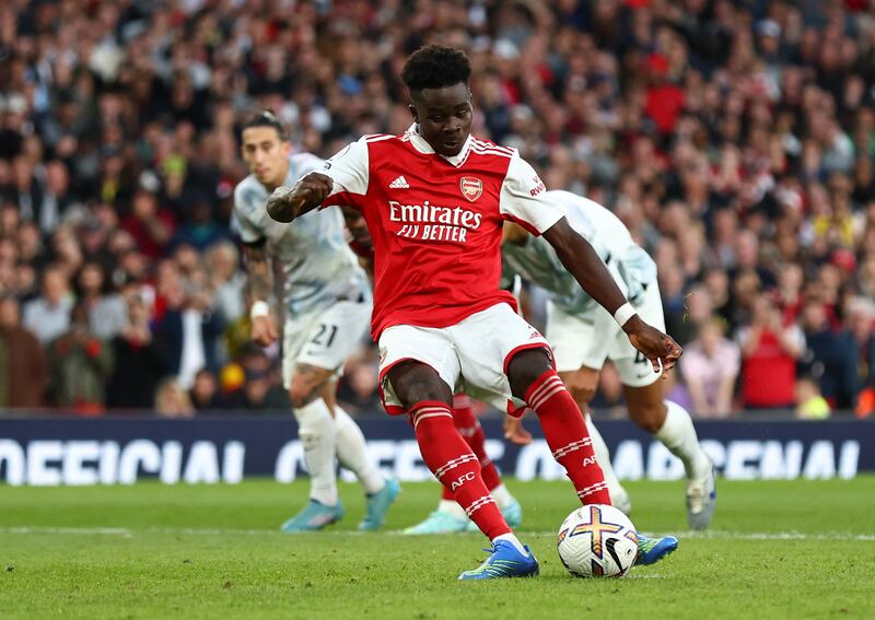 Arsenal's Bukayo Saka scores their third goal from the penalty spot. Reuters