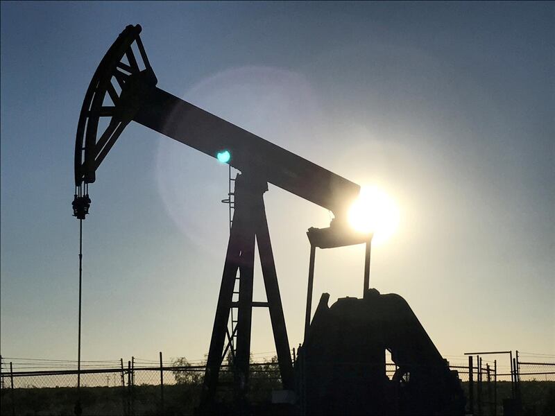 FILE PHOTO: An oil pump is seen operating in the Permian Basin near Midland, Texas, U.S. on May 3, 2017. Picture taken May 3, 2017. REUTERS/Ernest Scheyder/File Photo