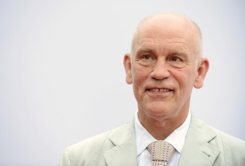 FILE - In this Thursday, July 11, 2013 file photo, John Malkovich arrives at the LA premiere of "Red 2" at the Westwood Village on in Los Angeles. Producers announced Tuesday Jan. 29, 2019 John Malkovich is returning to the London stage as a powerful Hollywood producer accused of sexual misconduct, in a play with strong echoes of the Harvey Weinstein saga. (Photo by Jordan Strauss/Invision/AP, File)