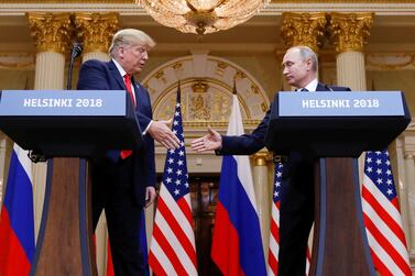 US President Donald Trump and Russia's President Vladimir Putin shake hands during a joint news conference last year. Reuters