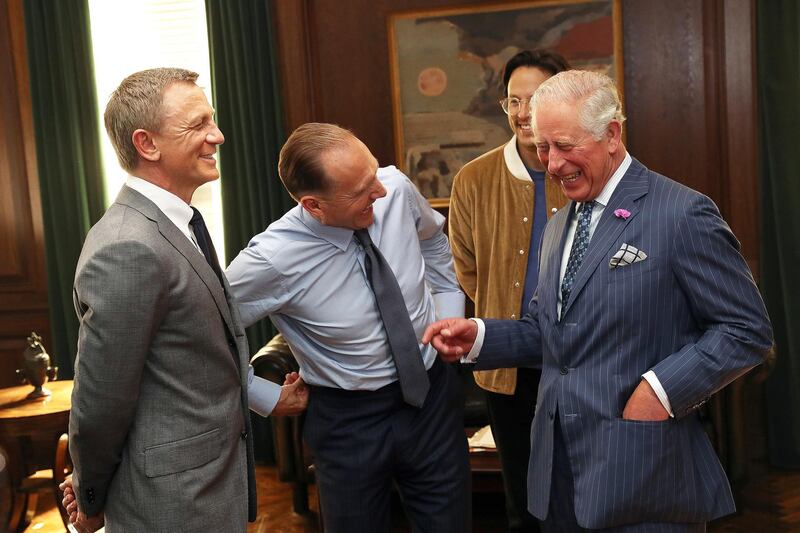 The royal also enjoyed a laugh with actors Daniel Craig and Ralph Fiennes, and director Cary Joji Fukunaga. Reuters